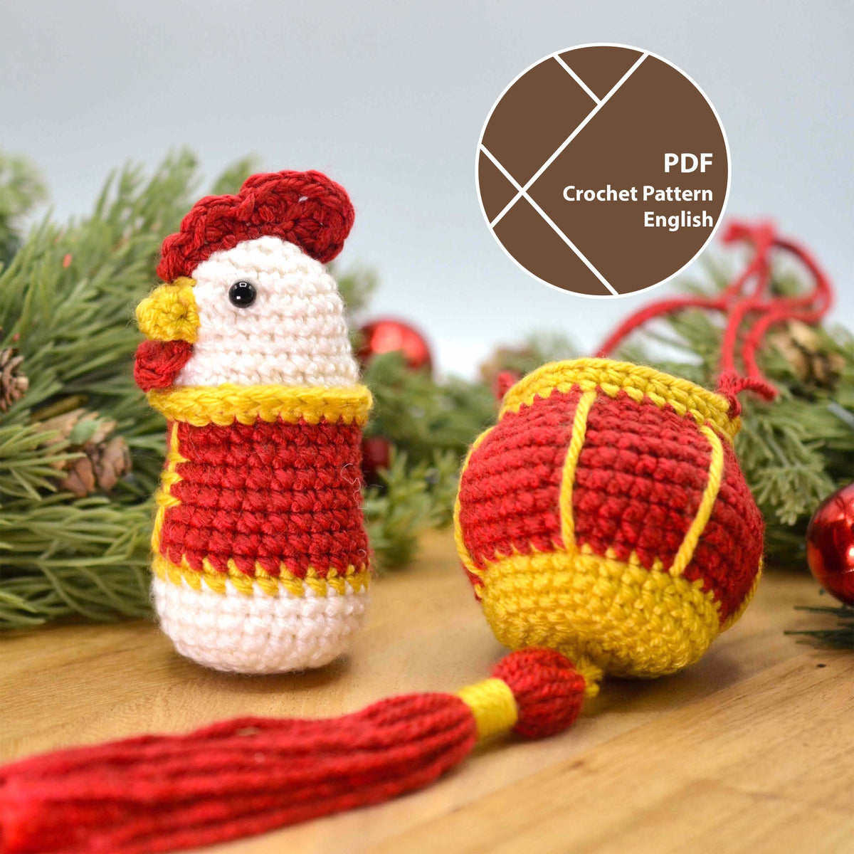 A crocheted chicken in a red festive costume is standing on a wooden surface. A crocheted red lantern is placed next the the chicken. There are some green branches behind. A label on the upper right corner indicates that this is a listing for a crochet pattern PDF that is written in English.
