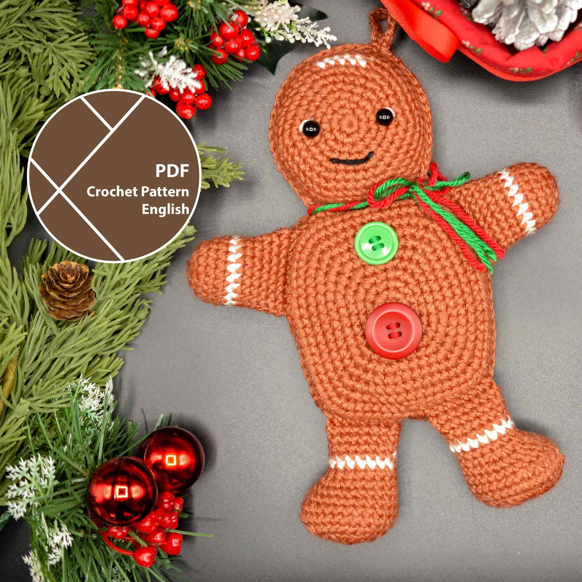 A crocheted gingerbread man ornament with white trim, green and red ribbon.