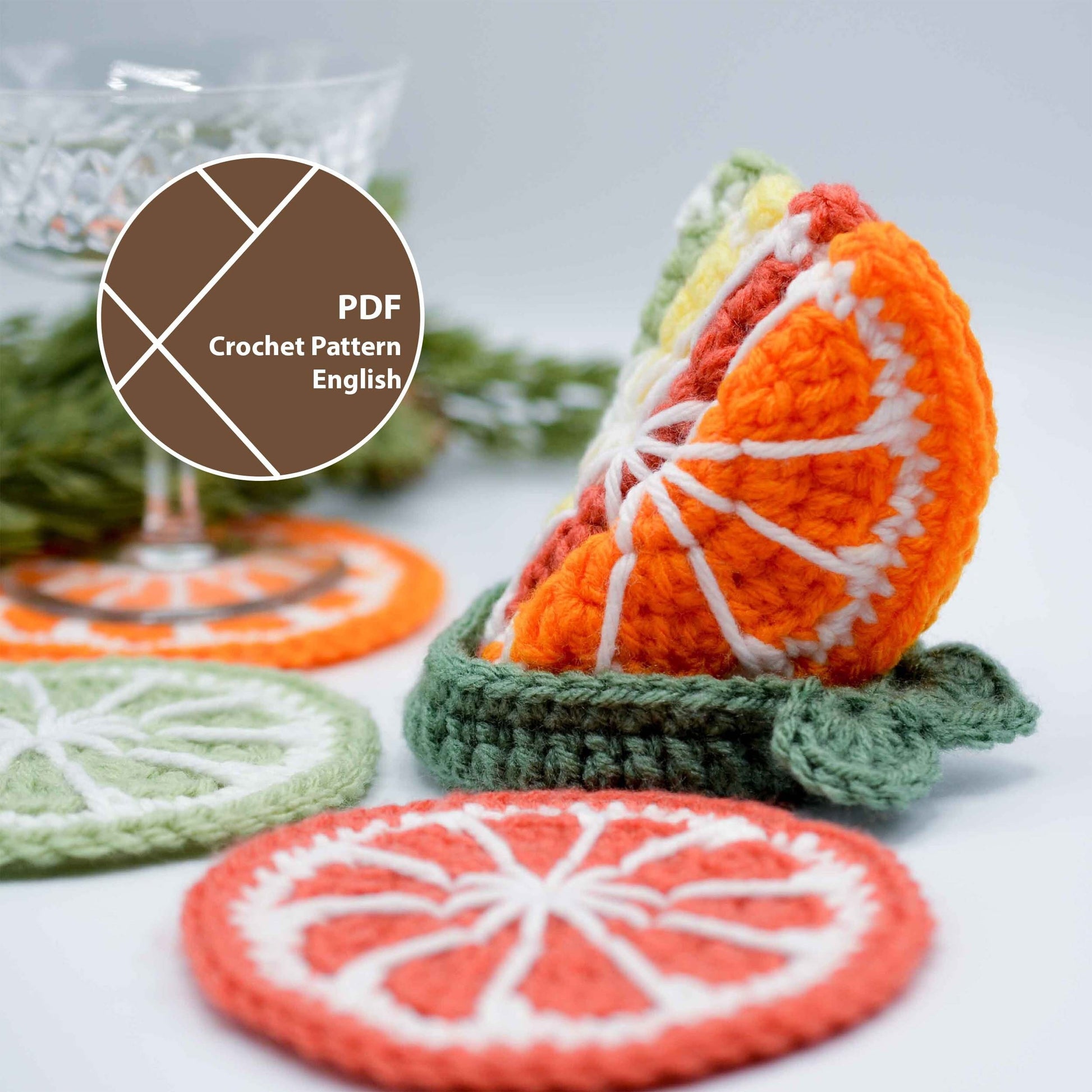 Crochet pattern for a set of citrus fruit coasters. The pattern includes instructions for making a lime, orange, and grapefruit coaster. The pattern is available in PDF format and is written in English.