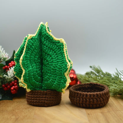 Crocheted Holly Christmas Tree Coaster Set. Two types of holders are displayed. One is with simple texture, and the other has more details that symbolizes a tree trunk. 