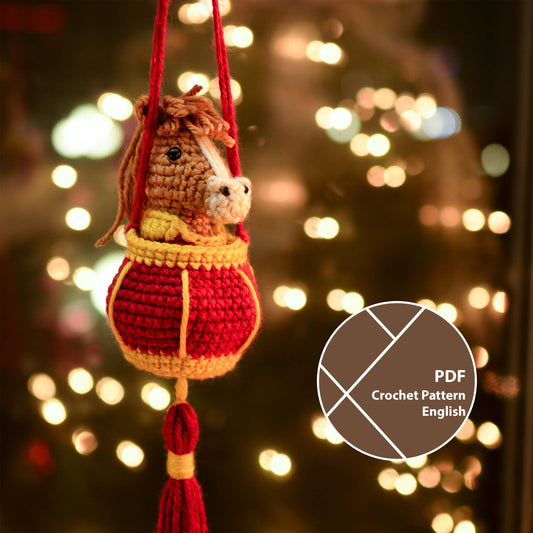 a crocheted horse in a red lantern