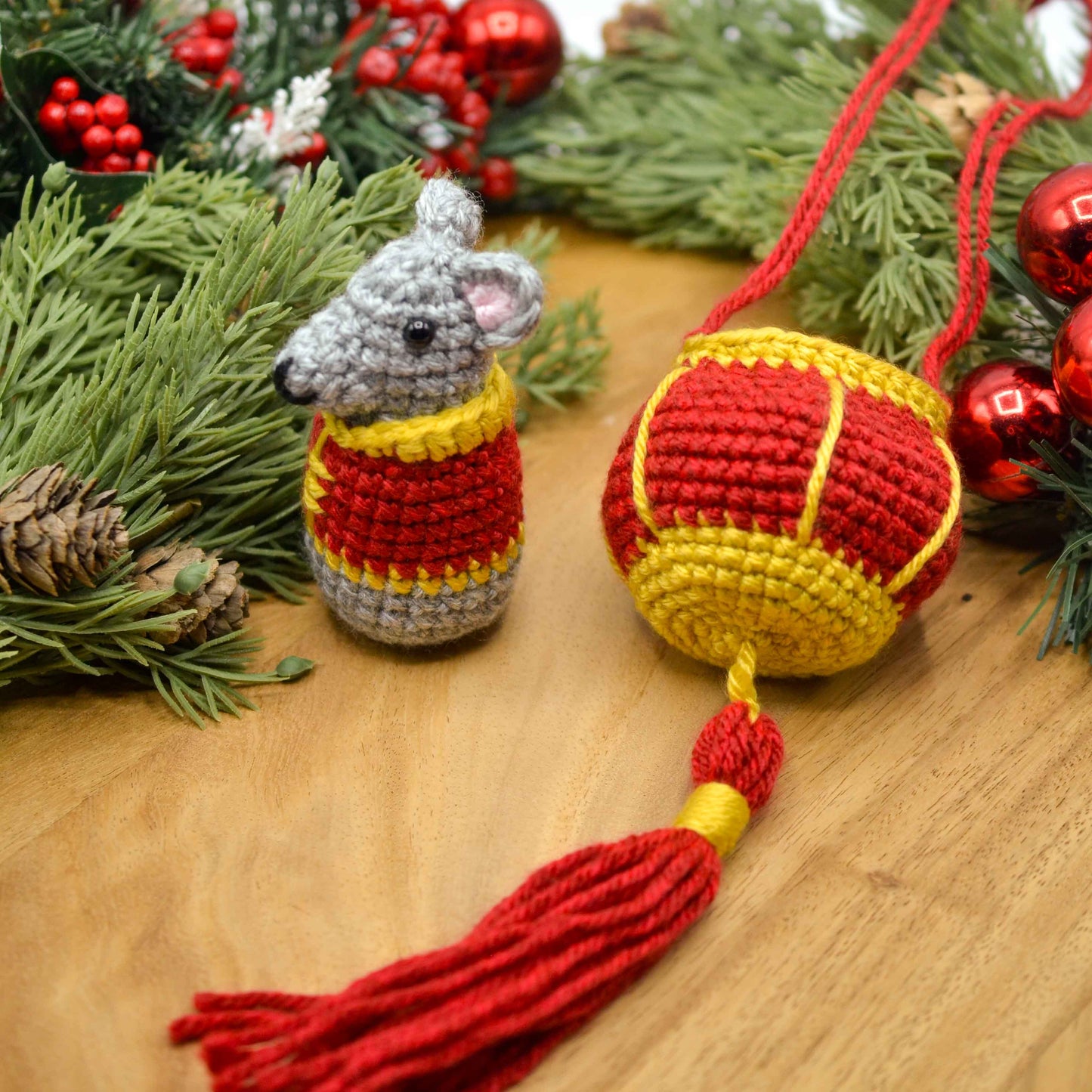 crocheted mouse and red lantern displayed on a wooden surface. The set is a lunar new year ornament. 